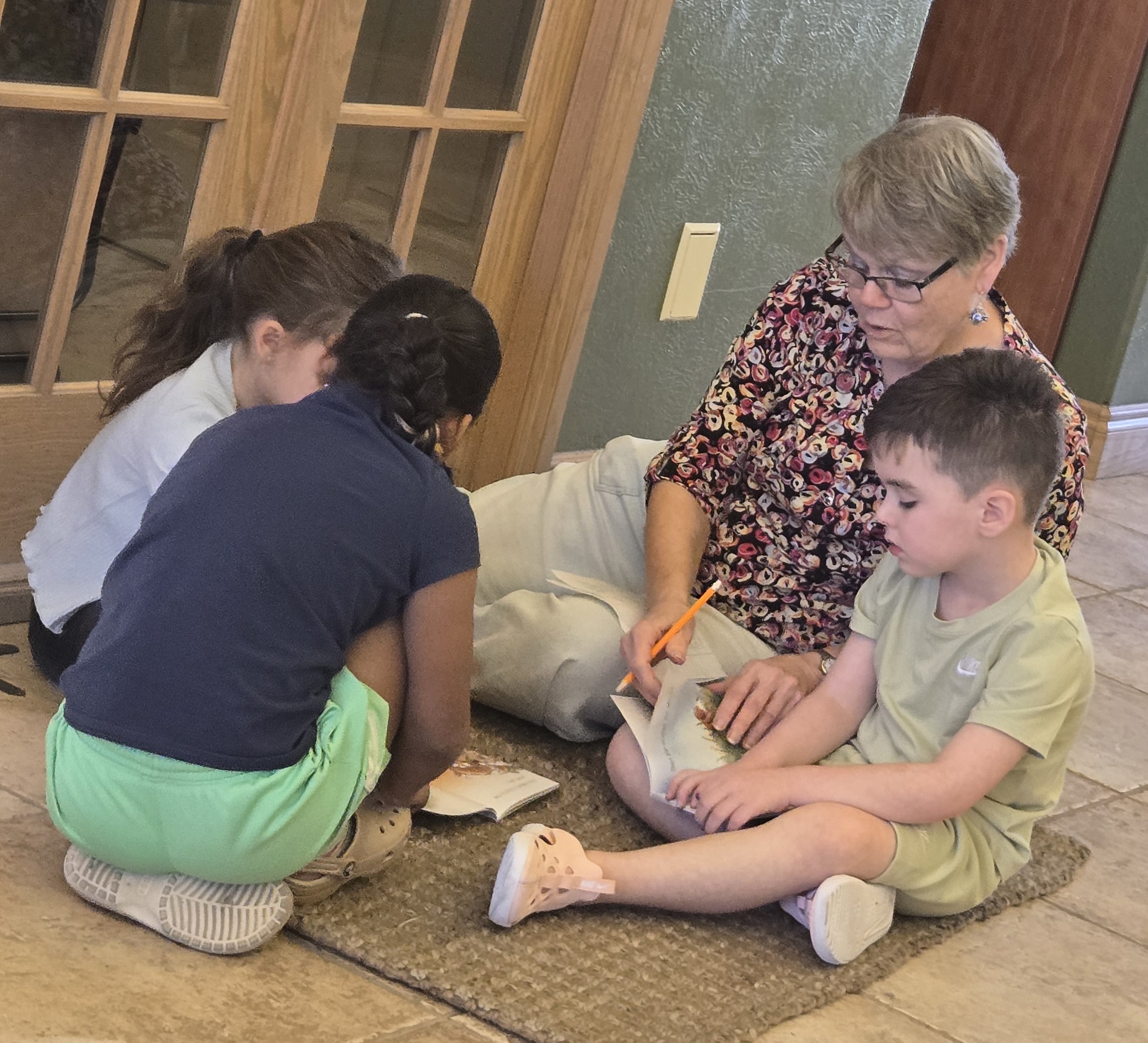 Teacher and students doing an activity together