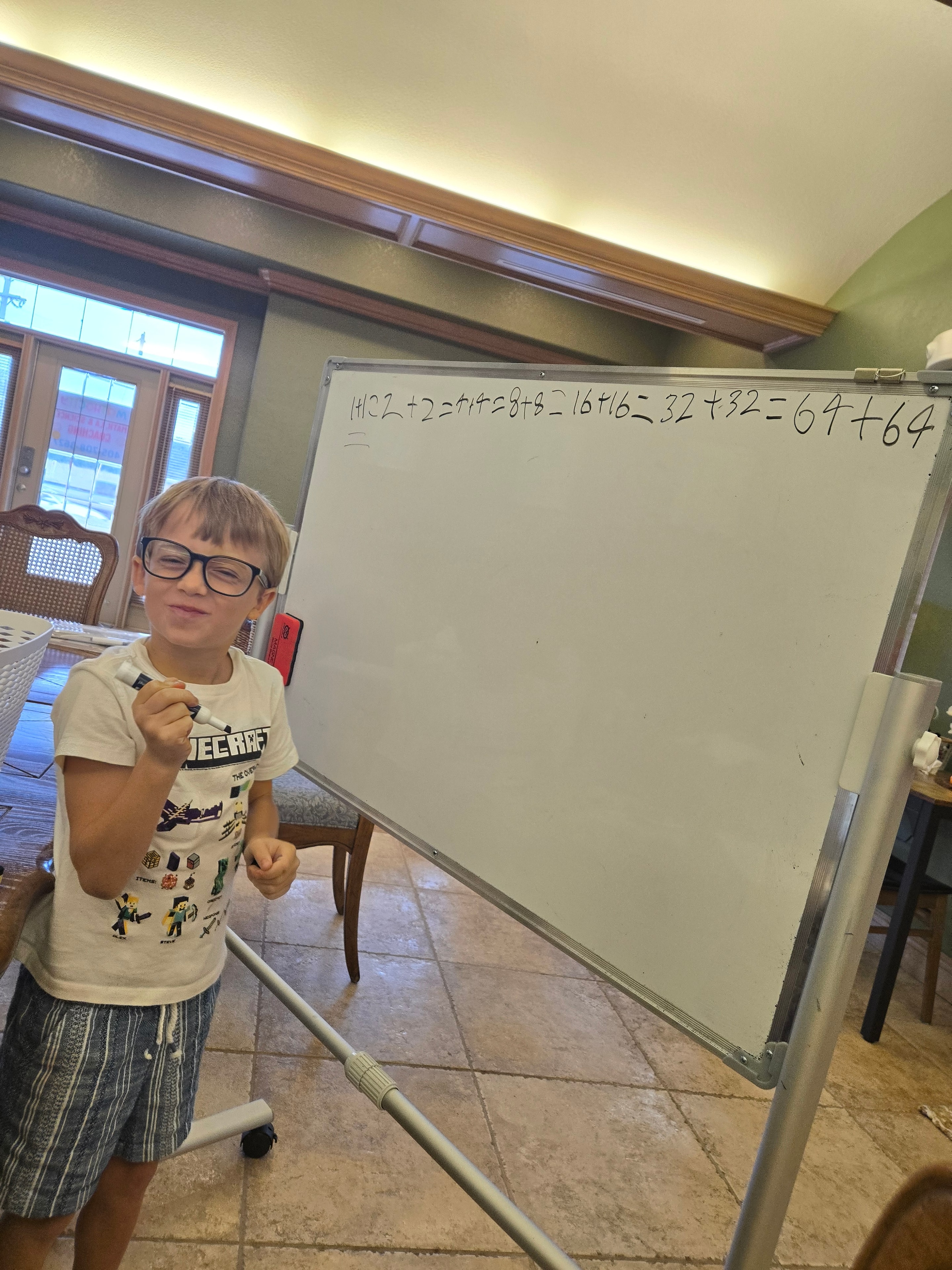 Person holding a whiteboard at Focus Microschool
