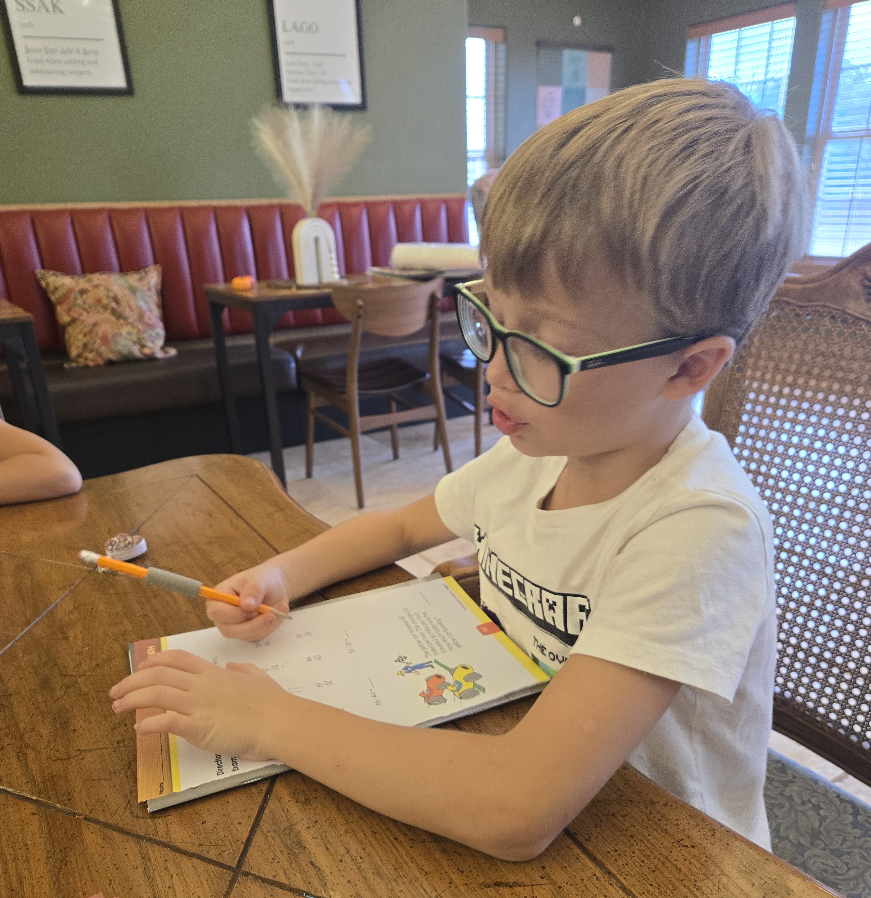 Student at a café doing schoolwork