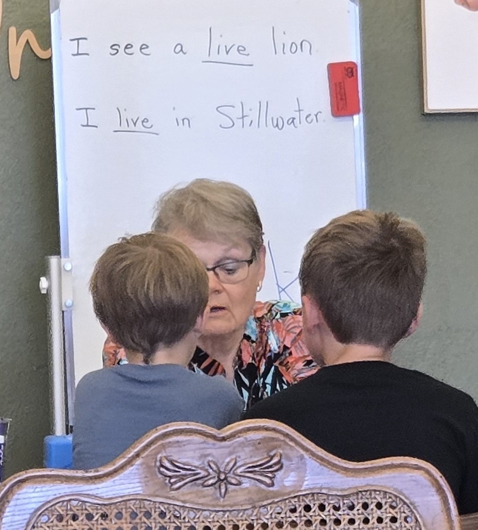 Teacher and students at the whiteboard