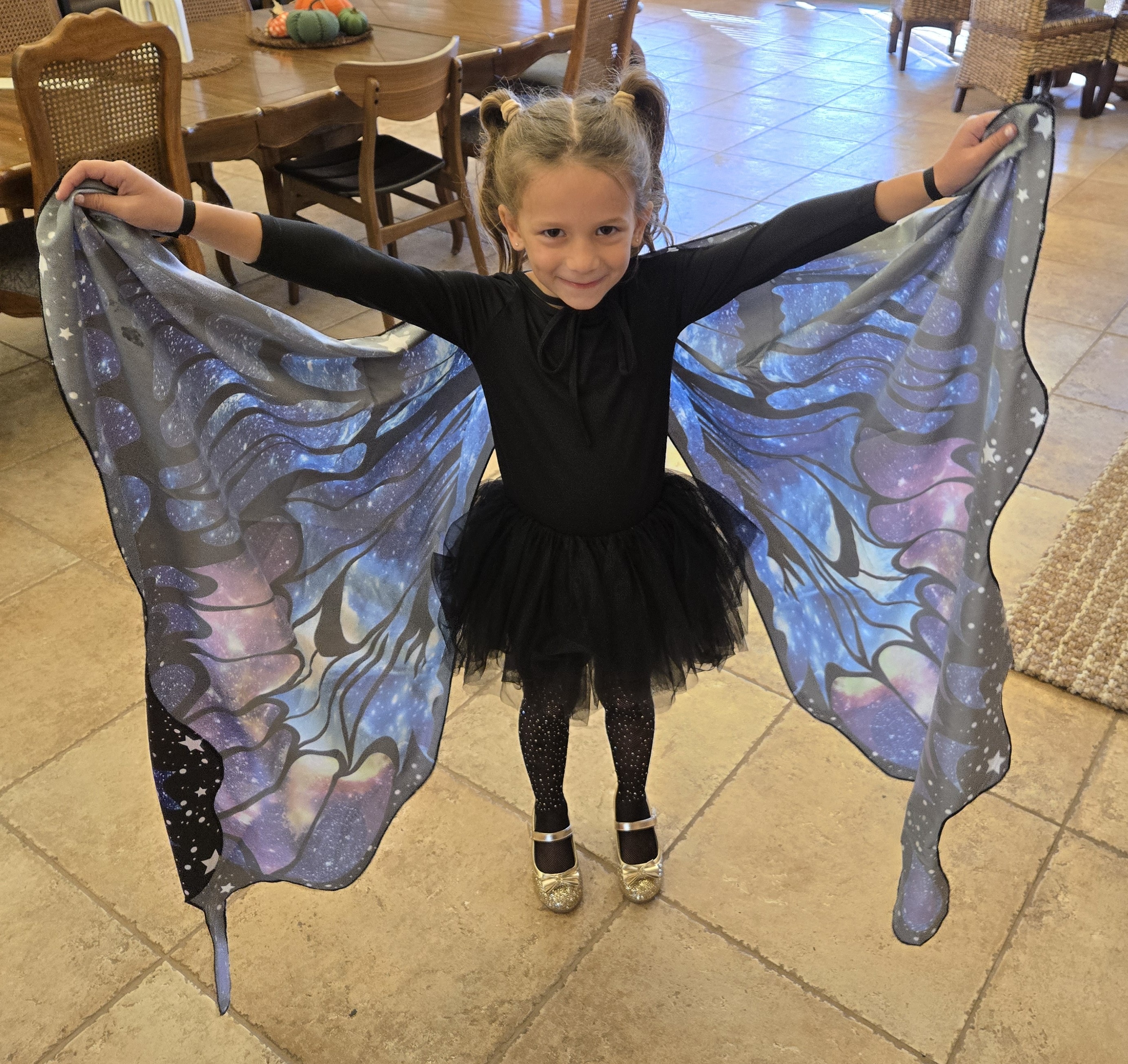 Student in butterfly wings costume at Focus Microschool